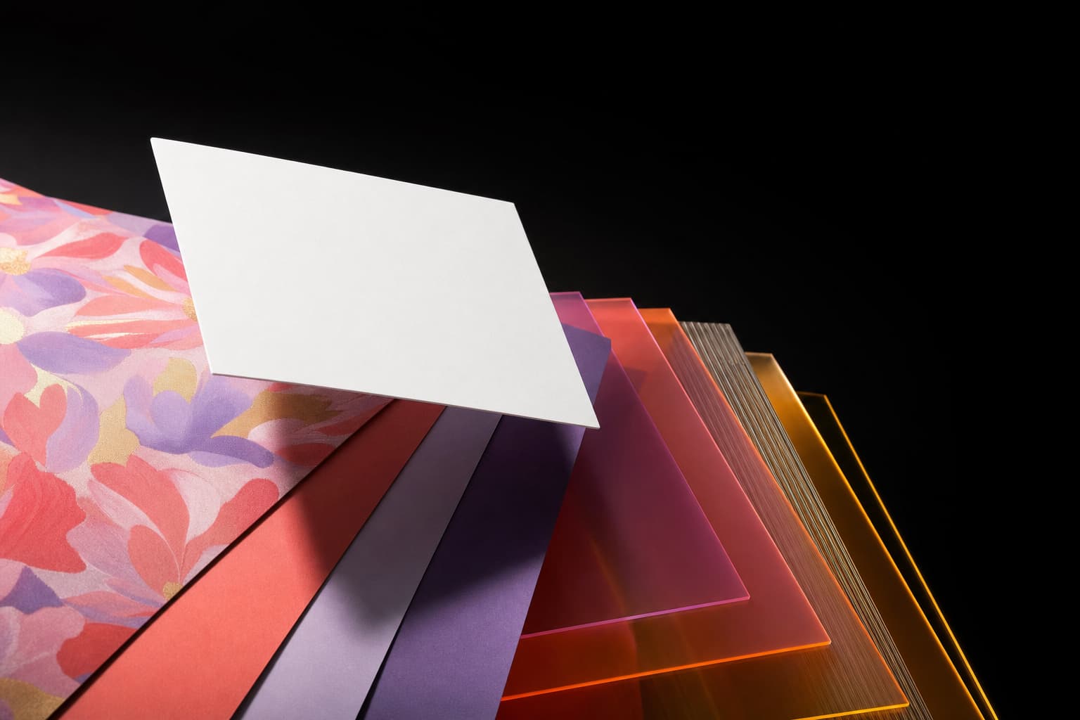 White image card floating above colorful paper and acrylic swatches